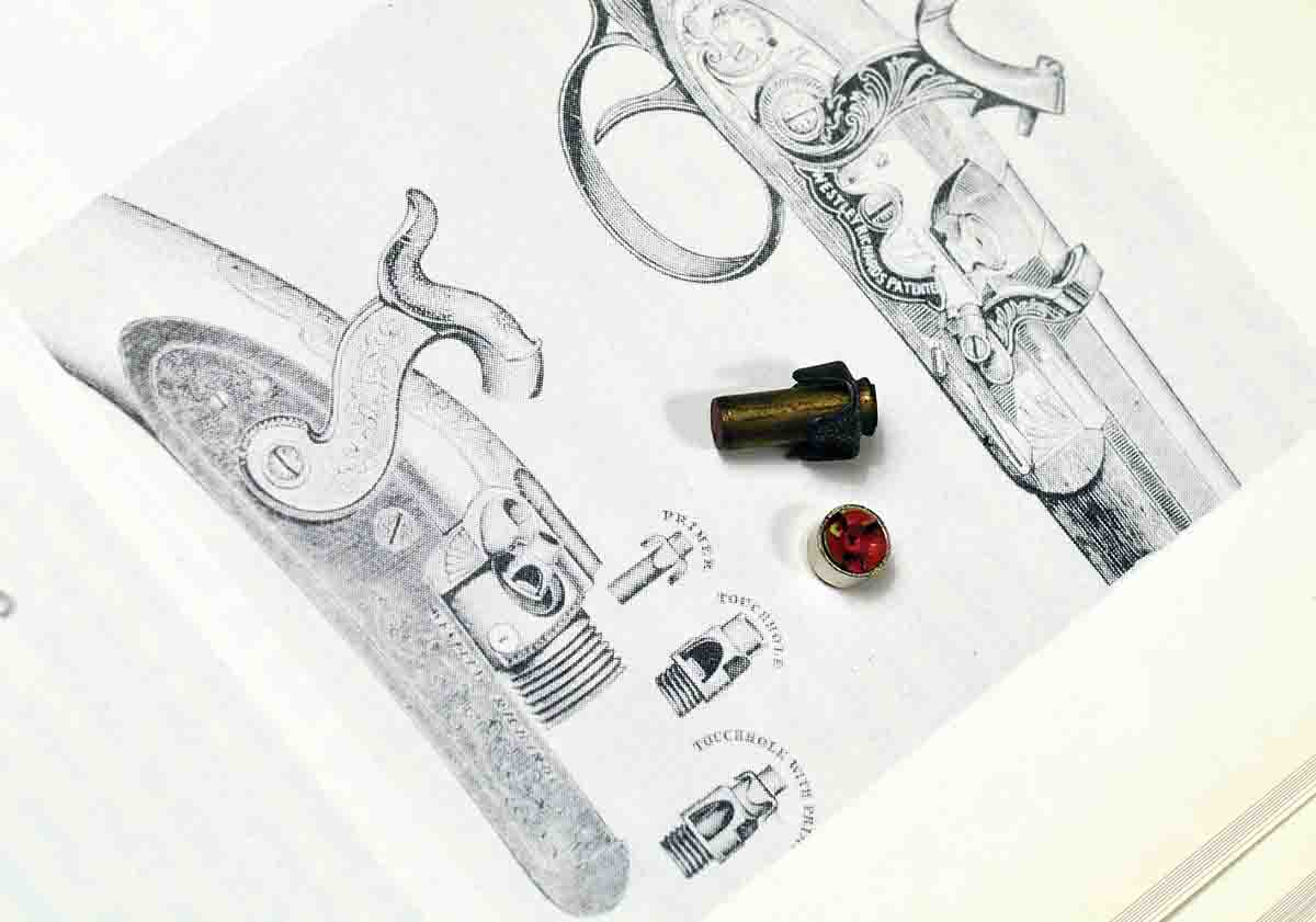 A tube primer next to a modern Federal Large Rifle primer. The illustration is from an old Westley Richards catalog, reproduced in The Shotgun – History and Development, by Geoffrey Boothroyd (1985). It shows the Westley Richards tube-lock mechanism. The upper illustration is the Westley Richards mechanism for using “patch” (paper) primers.